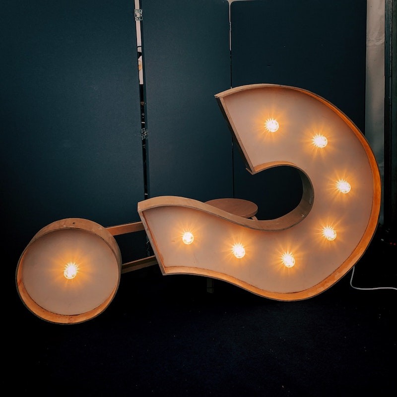 question mark in lights tipped over