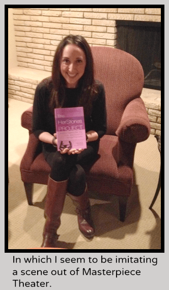 Nina Badzin holding The Herstories Project Book while sitting in a chair