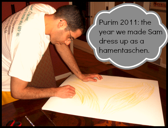 bryan making a purim costume coloring a poster