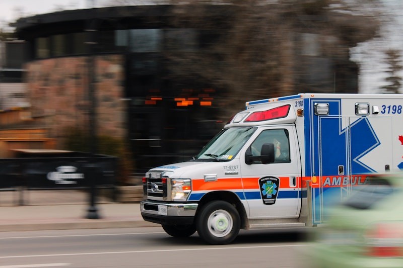 an ambulance racing down the street